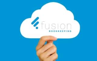 Fusion Bookkeeping, cloud accounting experts, image of someone holding a cloud with Fusion logo on it.